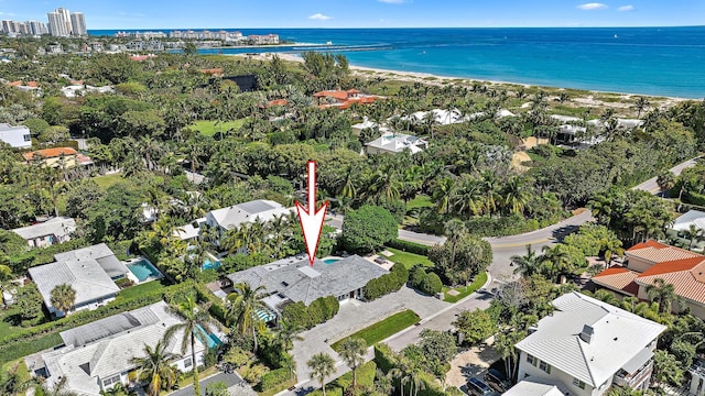 bird's eye view featuring a beach view and a water view