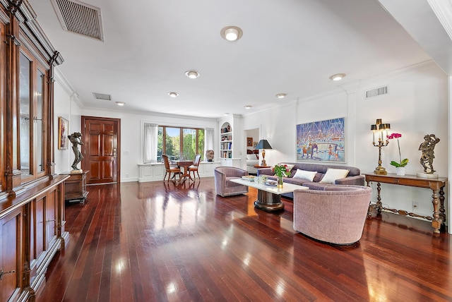 living room featuring crown molding, visible vents, and dark wood-style flooring