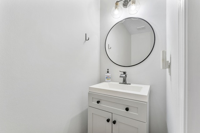bathroom featuring visible vents and vanity