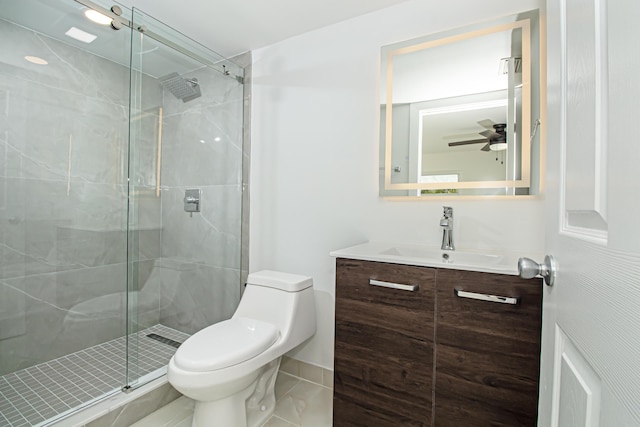 full bath featuring vanity, toilet, a ceiling fan, and a stall shower