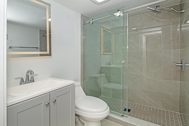 full bathroom with vanity, toilet, and a shower stall