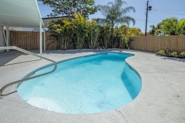 view of swimming pool with a patio area, a fenced in pool, and a fenced backyard