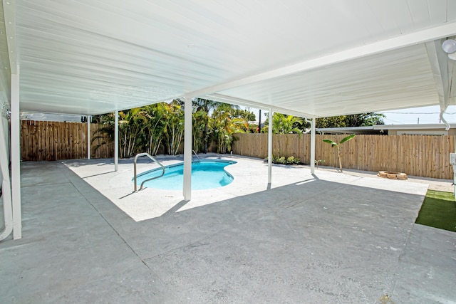 view of pool with a patio area, a fenced in pool, and a fenced backyard