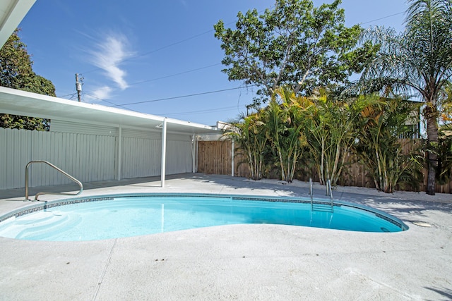 view of pool featuring a patio area, a fenced in pool, and a fenced backyard