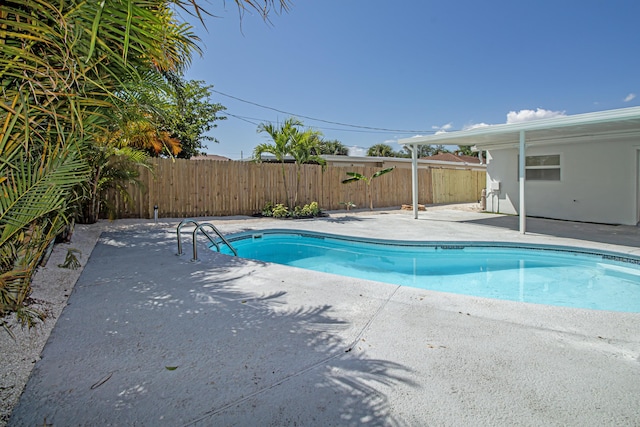 view of swimming pool with a fenced in pool, a patio, and a fenced backyard