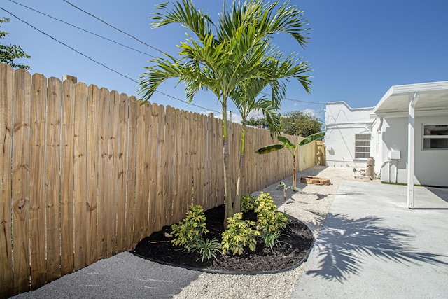 view of yard with a patio area and a fenced backyard