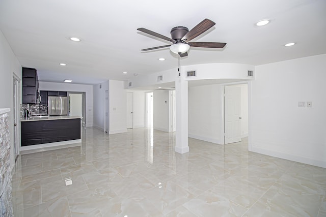 unfurnished living room featuring visible vents, recessed lighting, baseboards, and a ceiling fan