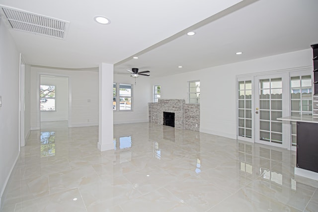 unfurnished living room featuring baseboards, visible vents, recessed lighting, ceiling fan, and marble finish floor