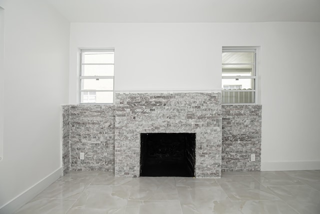 room details with baseboards and a fireplace