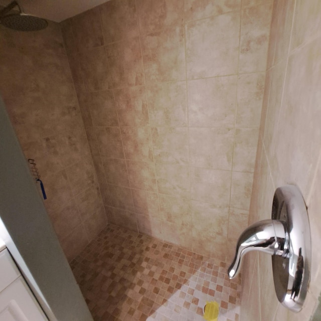 bathroom with a tile shower