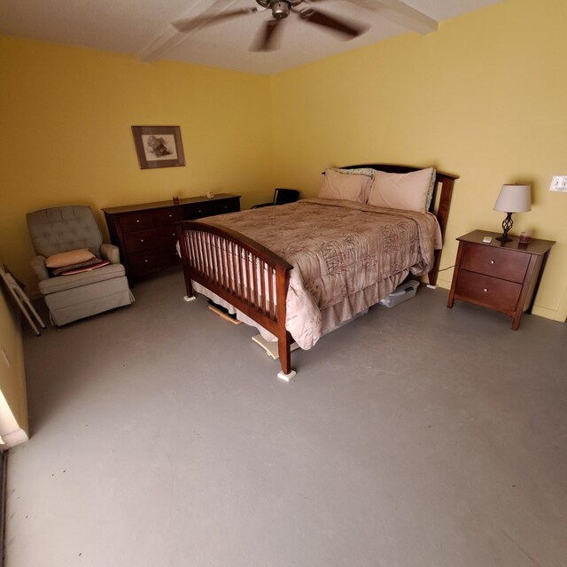 bedroom with finished concrete floors and a ceiling fan