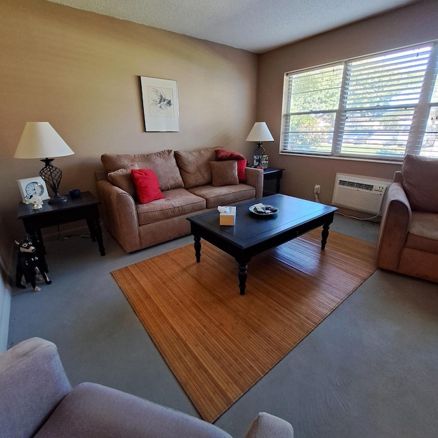 living area with a textured ceiling, carpet, and a wall unit AC
