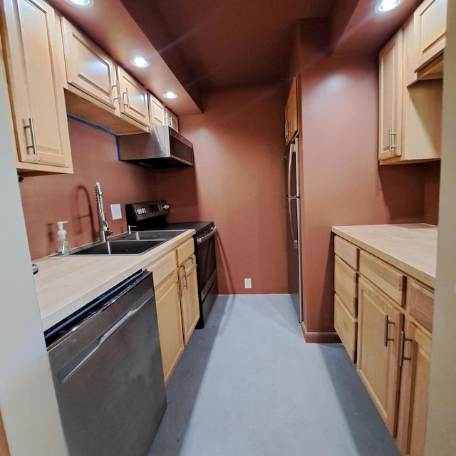 kitchen with a sink, range hood, recessed lighting, stainless steel appliances, and light countertops