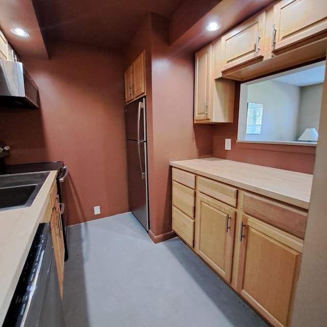 kitchen featuring recessed lighting, dishwasher, range hood, and freestanding refrigerator
