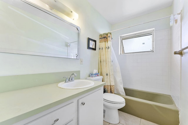 bathroom featuring tile patterned flooring, toilet, vanity, and shower / bath combo with shower curtain