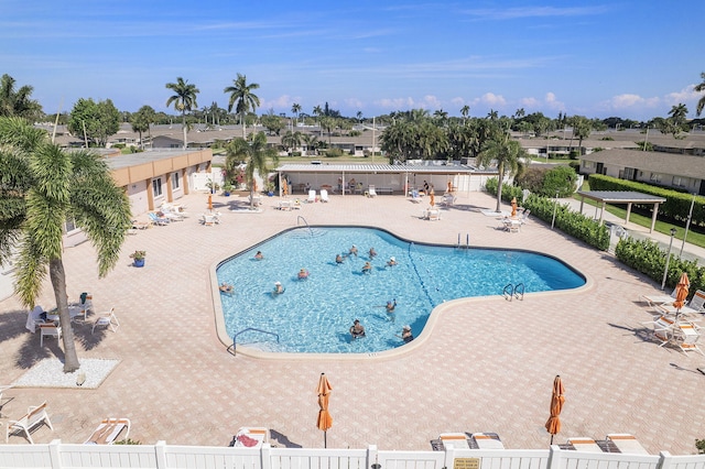 pool featuring a patio area and fence