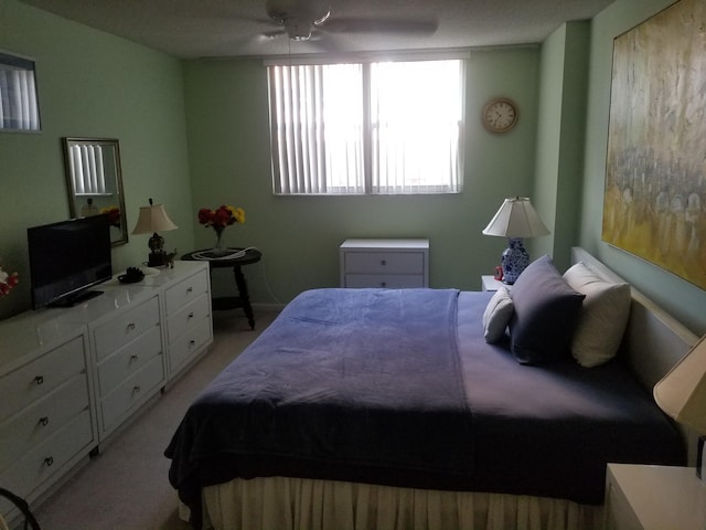 bedroom featuring light carpet