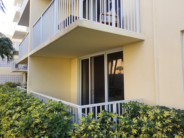 view of side of property featuring stucco siding