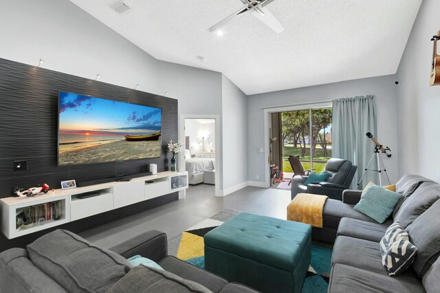 9238 E Vineland Ct E Unit E, Boca Raton, FL 33496 - living room featuring a ceiling fan, baseboards, finished concrete floors, vaulted ceiling, and a textured ceiling