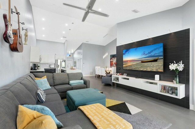 9238 E Vineland Ct E Unit E, Boca Raton, FL 33496 - living room with visible vents, high vaulted ceiling, a ceiling fan, and finished concrete floors