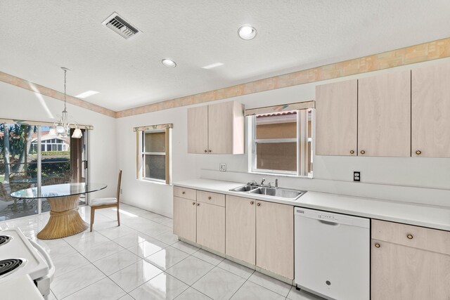 7267 Modena Dr, Boynton Beach, FL 33437 - kitchen featuring visible vents, light brown cabinetry, light countertops, white appliances, and a sink