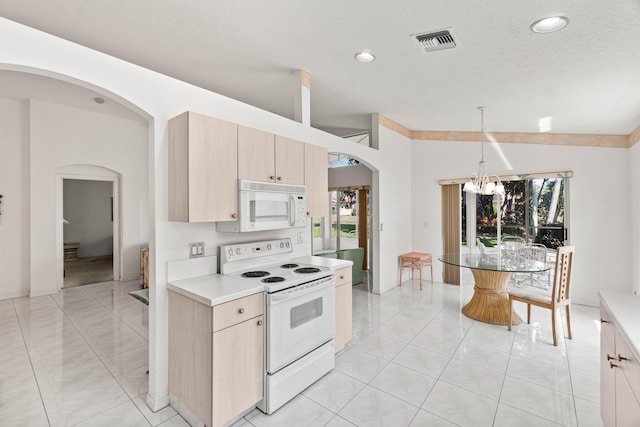 7267 Modena Dr, Boynton Beach, FL 33437 - kitchen featuring visible vents, a notable chandelier, light brown cabinets, white appliances, and arched walkways