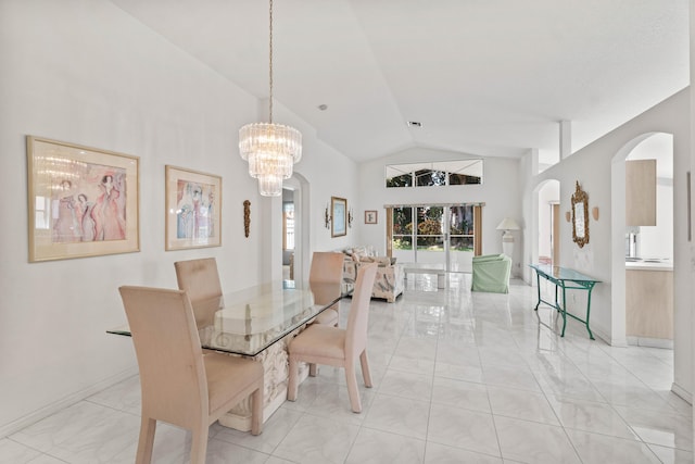 7267 Modena Dr, Boynton Beach, FL 33437 - dining space with baseboards, visible vents, high vaulted ceiling, arched walkways, and a notable chandelier