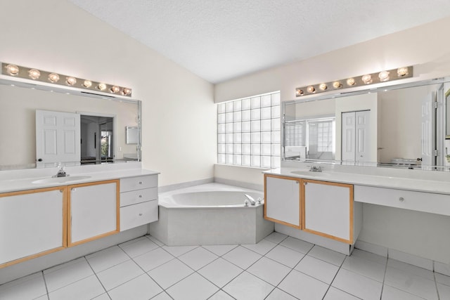 7267 Modena Dr, Boynton Beach, FL 33437 - full bath with a bath, tile patterned floors, two vanities, and a sink