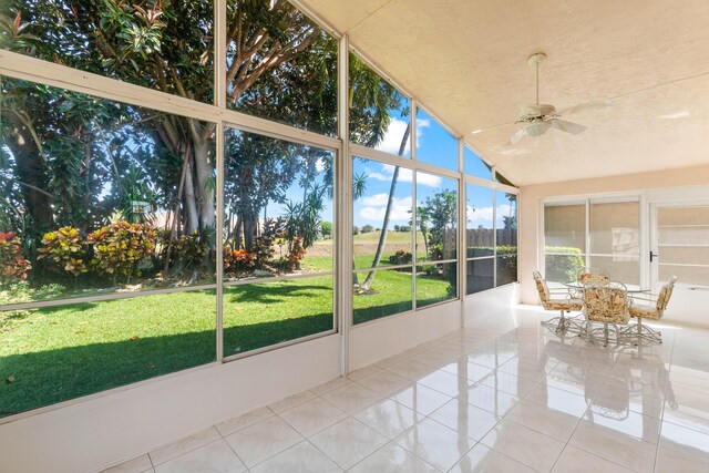 7267 Modena Dr, Boynton Beach, FL 33437 - unfurnished sunroom featuring lofted ceiling and a ceiling fan
