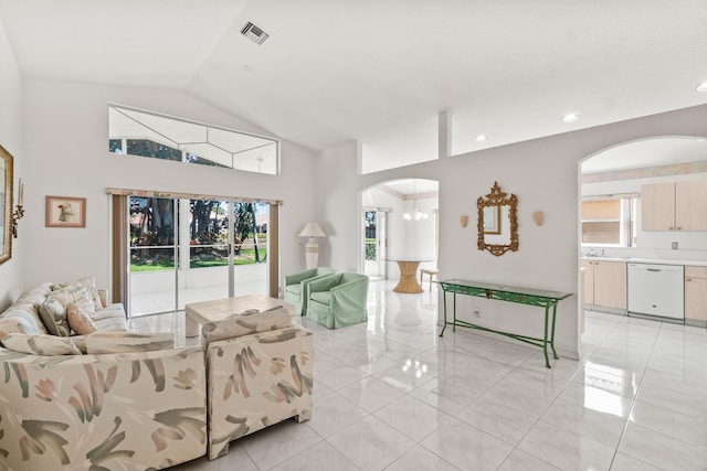 7267 Modena Dr, Boynton Beach, FL 33437 - living area with visible vents, arched walkways, lofted ceiling, and a healthy amount of sunlight