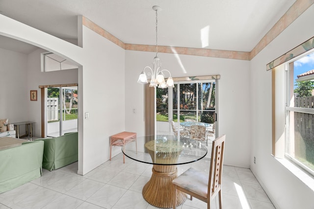 7267 Modena Dr, Boynton Beach, FL 33437 - dining area with a wealth of natural light, light tile patterned floors, and an inviting chandelier