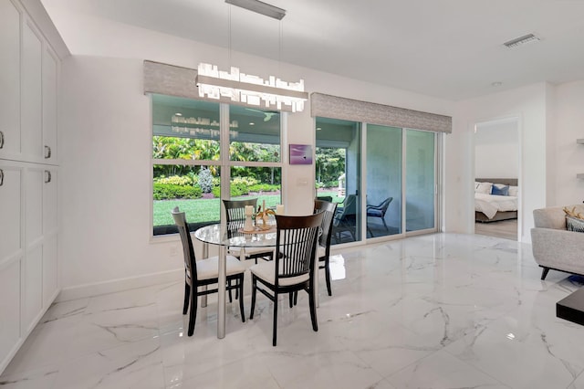 7855 Wildflower Shores Dr, Delray Beach, FL 33446 - dining area featuring baseboards and marble finish floor