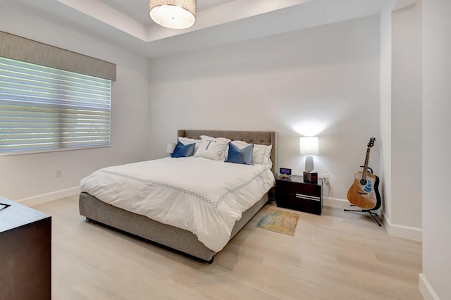 7855 Wildflower Shores Dr, Delray Beach, FL 33446 - bedroom with baseboards and wood finished floors