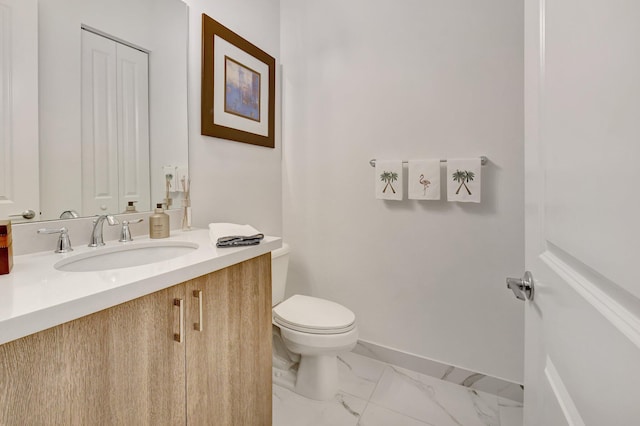 7855 Wildflower Shores Dr, Delray Beach, FL 33446 - bathroom featuring marble finish floor, toilet, vanity, and baseboards