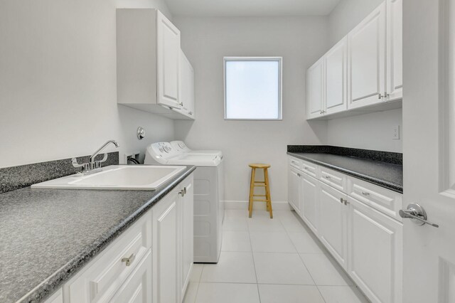 7855 Wildflower Shores Dr, Delray Beach, FL 33446 - laundry area featuring light tile patterned floors, baseboards, cabinet space, a sink, and independent washer and dryer