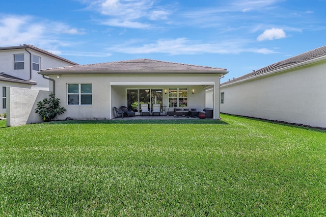 7855 Wildflower Shores Dr, Delray Beach, FL 33446 - rear view of property with a patio, a tiled roof, a lawn, and stucco siding