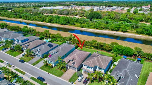 7855 Wildflower Shores Dr, Delray Beach, FL 33446 - drone / aerial view featuring a residential view and a water view