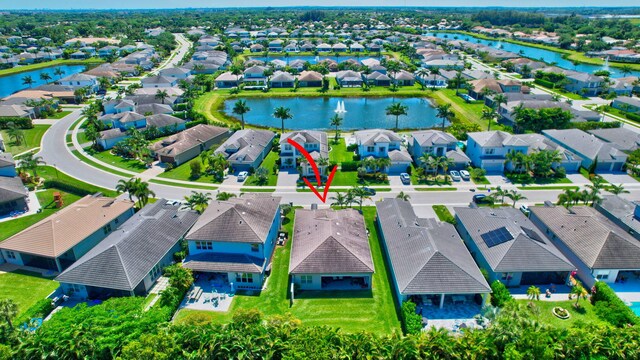 7855 Wildflower Shores Dr, Delray Beach, FL 33446 - drone / aerial view featuring a residential view and a water view
