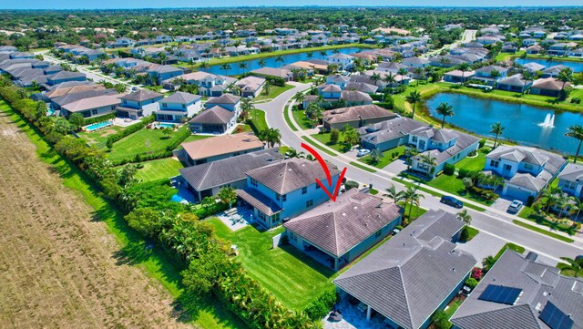 7855 Wildflower Shores Dr, Delray Beach, FL 33446 - drone / aerial view with a residential view and a water view