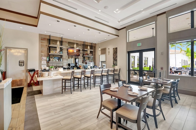 7855 Wildflower Shores Dr, Delray Beach, FL 33446 - dining room with light wood finished floors, recessed lighting, french doors, and a towering ceiling
