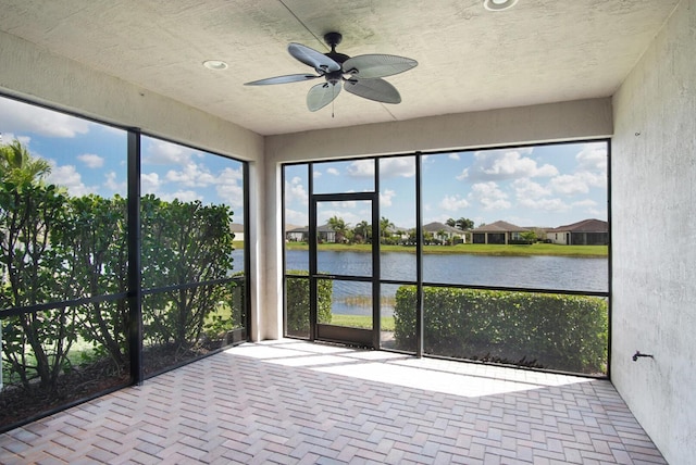 11243 SW Parkside Dr, Port Saint Lucie, FL 34987 - unfurnished sunroom featuring a water view and ceiling fan