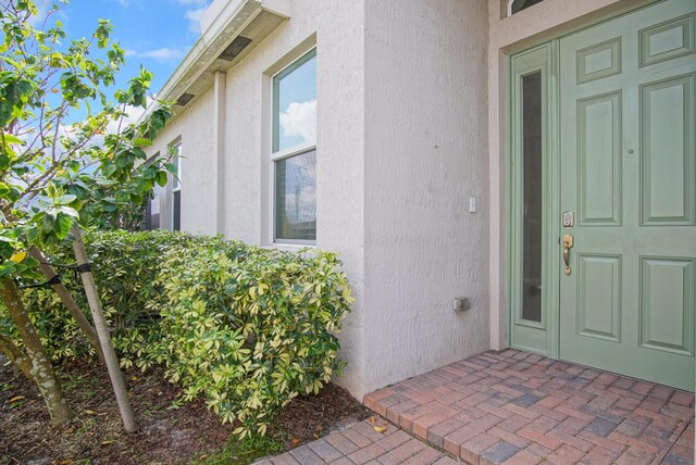 11243 SW Parkside Dr, Port Saint Lucie, FL 34987 - entrance to property with stucco siding