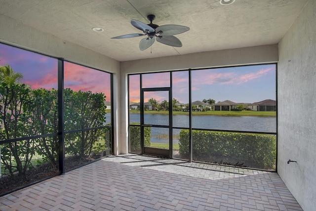11243 SW Parkside Dr, Port Saint Lucie, FL 34987 - unfurnished sunroom featuring a water view and a ceiling fan