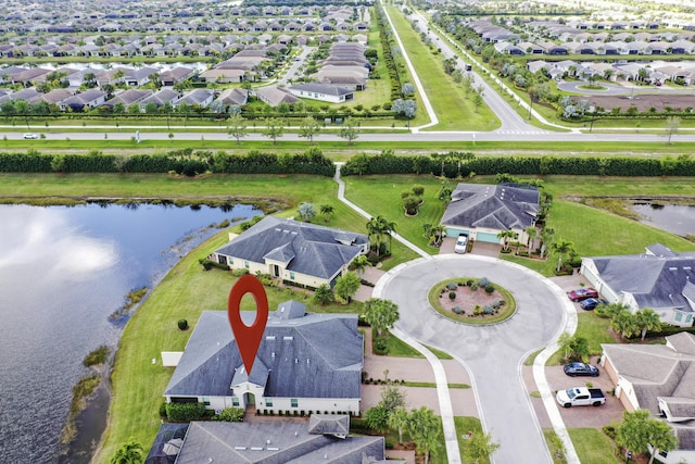 aerial view with a residential view and a water view