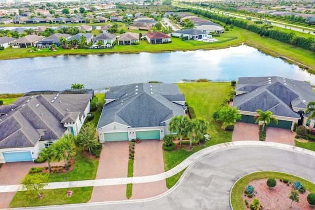 bird's eye view featuring a residential view and a water view