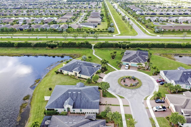 bird's eye view with a residential view and a water view