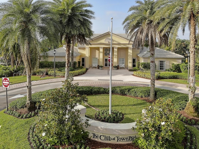 11243 SW Parkside Dr, Port Saint Lucie, FL 34987 - exterior space featuring stucco siding, a tiled roof, and a front yard