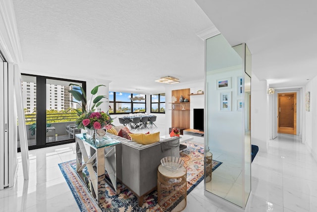 3450 S Ocean Blvd Unit 605, Highland Beach, FL 33487 - living area with floor to ceiling windows, a textured ceiling, and light marble finish flooring