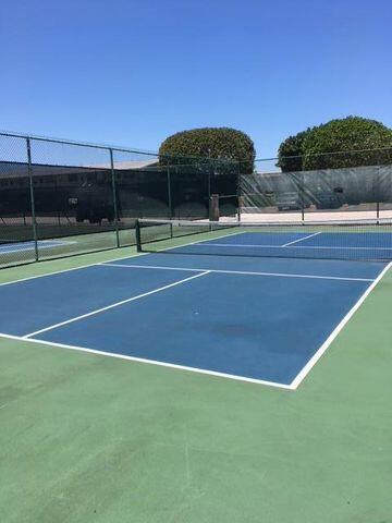 view of sport court with community basketball court and fence