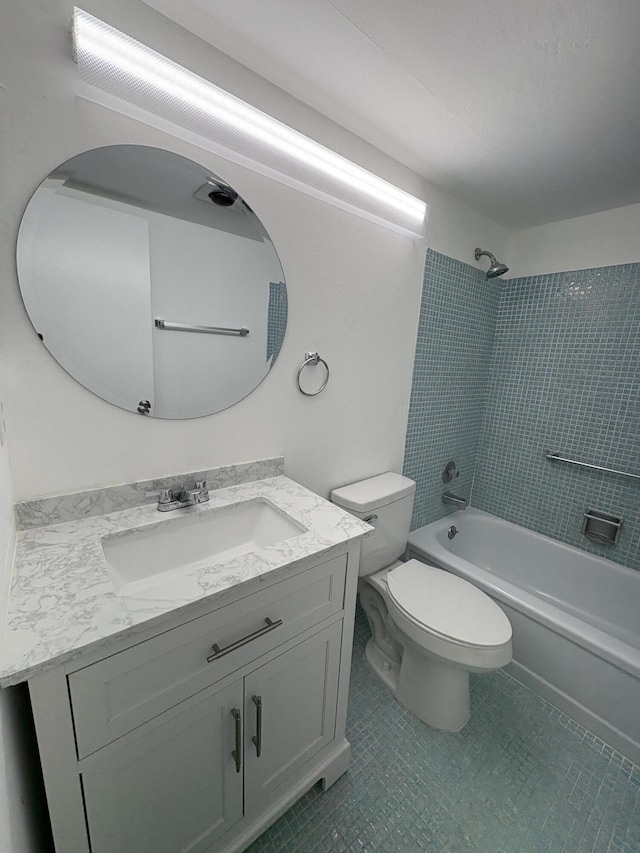 full bath with  shower combination, toilet, tile patterned floors, and vanity